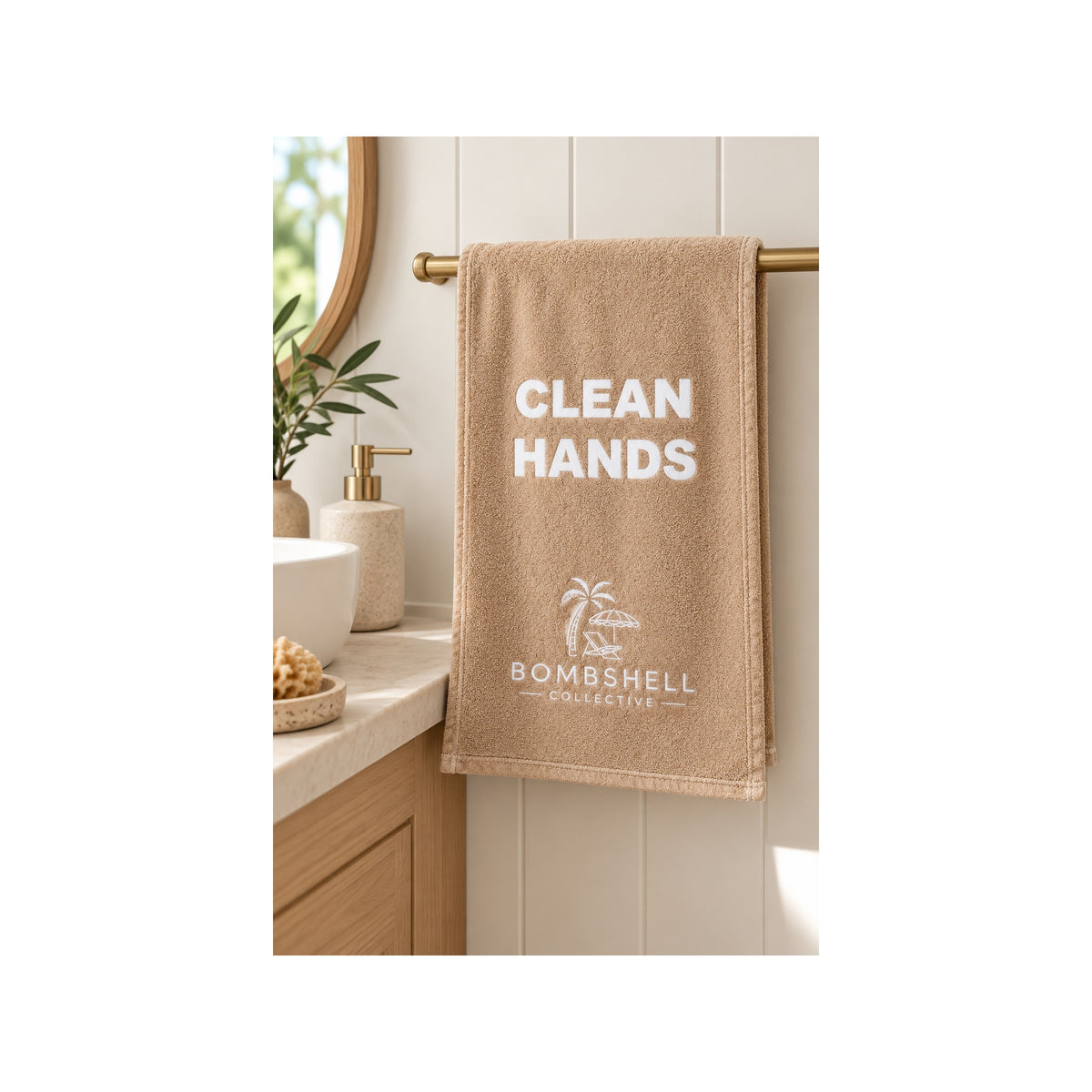 Neutral sand bathroom hand towel featuring the playful Clean Hands slogan