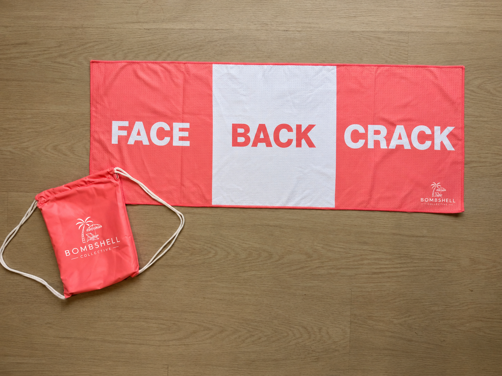 Bombshell Collective Face Back Crack gym towel in coral, featuring three labelled sections and a drawstring carry bag.