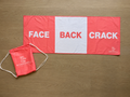 Bombshell Collective Face Back Crack gym towel in coral, featuring three labelled sections and a drawstring carry bag.