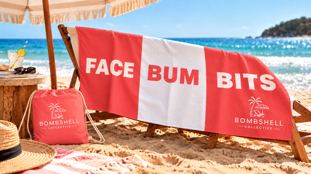 Flatlay of the large Bombshell Collective Face Bum Bits beach towel in coral with matching waterproof carry bag, perfect for holding personal beach essentials.