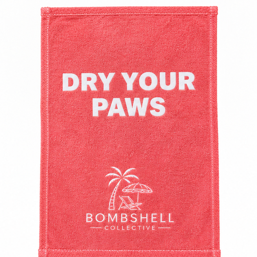 Bombshell Collective Dry Your Paws hand towel in Coral with white lettering and signature beach logo.
