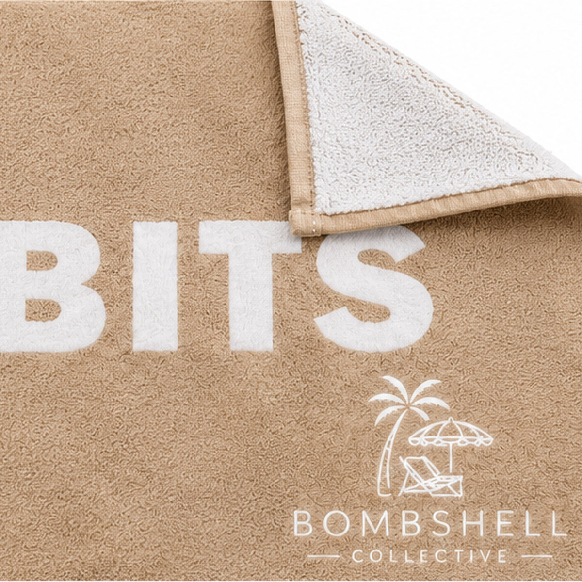Close-up of the Face Bum Bits bath towel in Sand showing textured fabric, stitched edges, folded white reverse and Bombshell Collective logo.